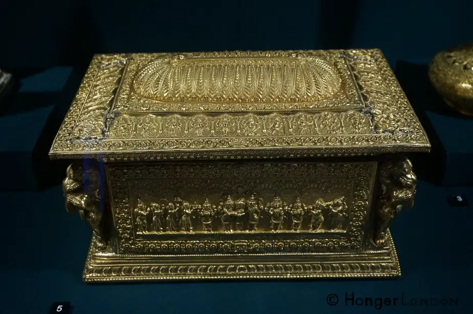 Address Casket Made from Gold and Sandalwood. It depicts Hindu faith figures. From the Area of Madurai, swami craftsmanwork. The corner figures are elephant headed lions called yalis 1875