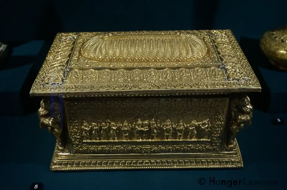 Prince of Wales trip to India (1875-76) Splendours of South East Asia 9 Address Casket Made from Gold and Sandalwood. It depicts Hindu faith figures. From the Area of Madurai, swami craftsmanwork. The corner figures are elephant headed lions called yalis 1875