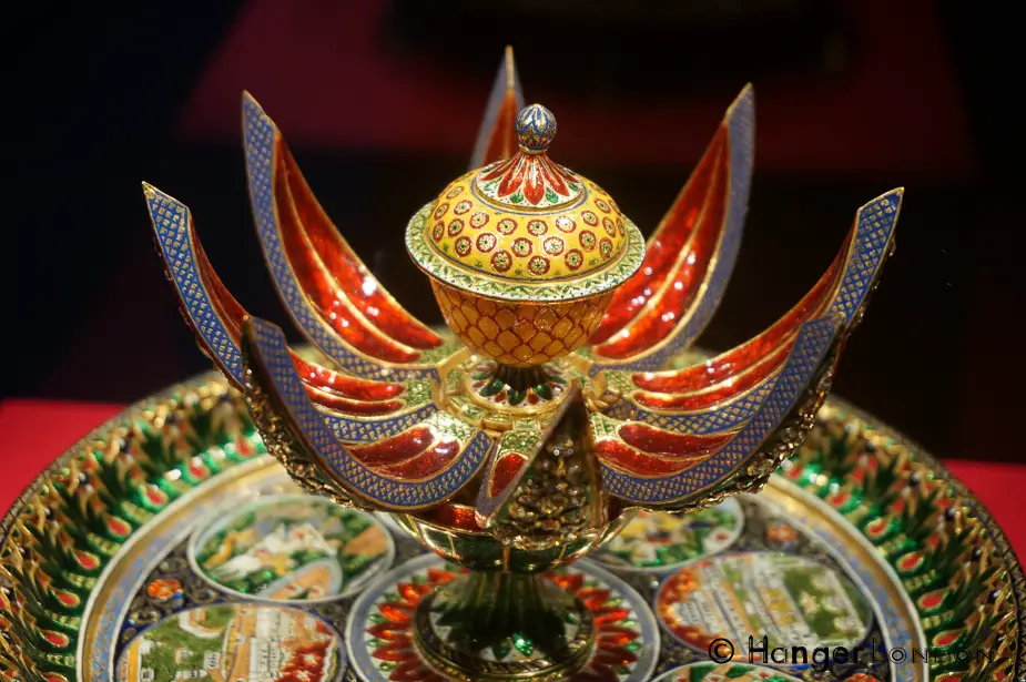Enameleld Gold red, green yellow pearls, diamonds elephant figurines yali hindu faith form the stand. A Gift from RAm Singh II Maharaja of Jaipur. 1876 Normally these would have held rose water the design incorporates the Chandra Mahal and Amber Fort in Jaipur. 