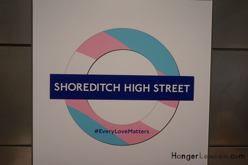 Shoreditch High street TFL rondel in the colours of the Rainbow Flag for Pride London 2018