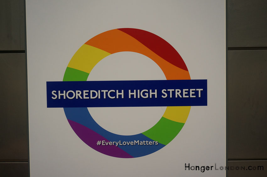 Shoreditch High street TFL rondel in the colours of the Rainbow Flag for Pride London 2018