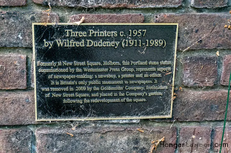From The Blitz to Blooms: Goldsmiths' Garden in the Heart of London 7 Three Printers Sculpture info plaque. Artist Wilfred Dudeney, the only uk statue to Newspaper Industry