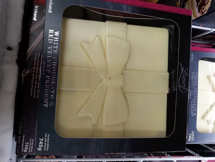 The Christmas Packaging the Pops! 22 White chocolate present box shaped cake Iceland