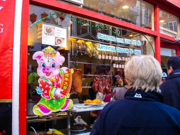 window of food outlet pig artwork