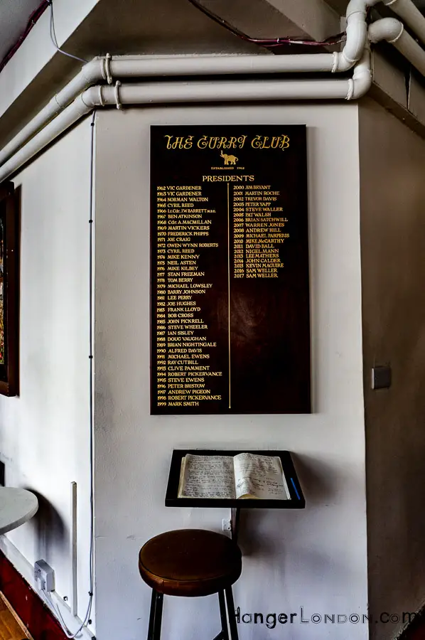 Presidents of the Curry Club plaque inside the bar lounge of the India Club