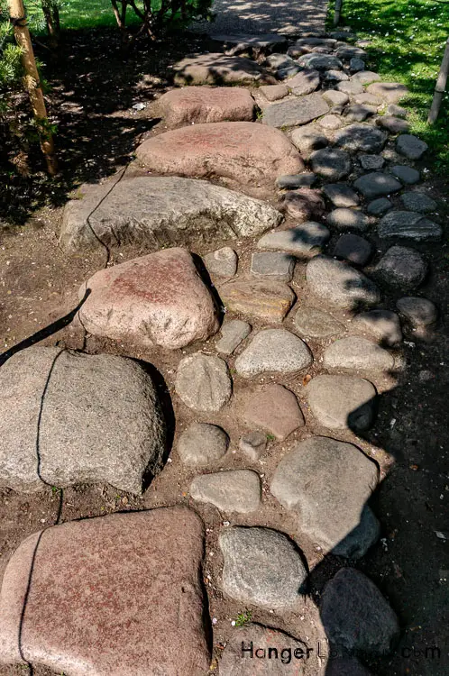 stone pathway to the water fountains of the Japanese Garden Holland park